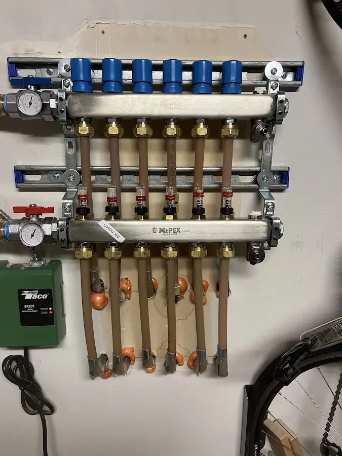 Plumber performing Water Heater Repair at a residential property in Mapleton